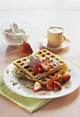 Waffles with strawberries and vanilla cream