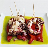Octopus on red peppers in olive oil