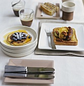 Table laid for breakfast with various dishes