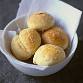 Four bread rolls in a bowl