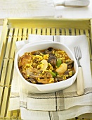 Arroz caldoso (rice soup, Spain) with rabbit and chicken