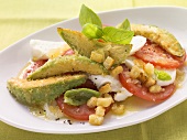 Tomato and mozzarella salad with fried avocado