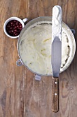 Whipped cream and redcurrants, seen from above