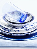 Oriental plates (blue and white) and a drinking glass