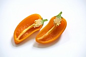 Orange coloured mini pepper, halved