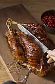 Roast turkey with pomegranate being carved