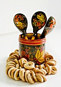 Bubliki (Russian bread rings) and a pot with wooden spoons