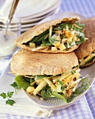 Wholemeal pita pockets filled with spinach & walnut salad