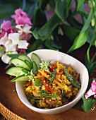 Curried rice with chicken, mangetout and sesame seeds