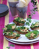 Wholemeal crostini topped with mangetout