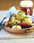 Sauerkraut dumplings with sausages