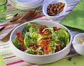 Lettuce with strips of fried bacon and croutons
