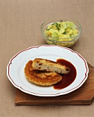 Milzwurst (Bavarian sausage) with gravy, potato & cucumber salad