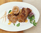 Veal rolls filled with ham, anchovies and capers