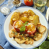 Pork fillet with fried potatoes, tomatoes and eggs