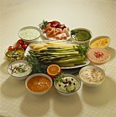 Green and white asparagus with several sauces