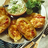 Baked potatoes with cheese and bacon topping
