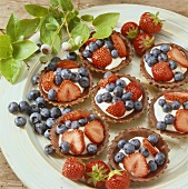 Mixed berry tartlets in chocolate tart shells