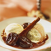 Plums in red wine with vanilla ice cream