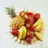 Exotic fruit and strawberries in fruit bowl