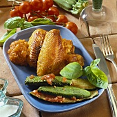Chicken wings with courgettes and tomato sauce