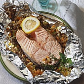 Salmon cutlet with vegetables baked in foil