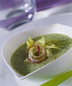 Green soup with onion rings