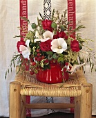 Arrangement of raspberries, mallow, poppy seed capsules & roses