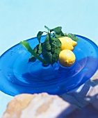 Two lemons on blue plate