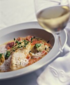 Fish fillet with tomato sauce and herbs