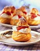 Profiteroles filled with strawberries and cream