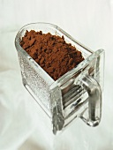 Ground cinnamon in a glass drawer container