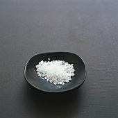 Coarse salt in small black dish