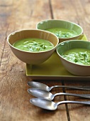 Cold bean and pea soup in three bowls