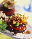 Grilled aubergine and tomato tower with garlic