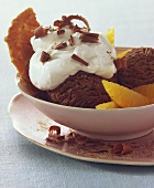 Chocolate ice cream with cream and tipsy orange segments