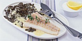 Poached cod fillet with lentils and mustard sauce