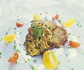 Courgette and carrot rosti with herb quark and tomatoes