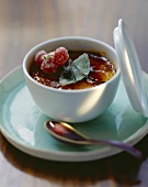 Crème brûlée with rosemary in small bowl