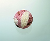 A scoop of strawberry and vanilla ice cream