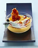 Crème brûlée with rosemary in glass dish