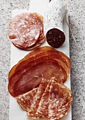 Various types of Italian salami, bresaola and sopressa