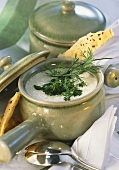 Creamy cheese soup with fresh herbs