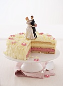 A wedding cake with a section removed