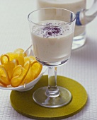 Soya drink with persimmon, banana and poppy seeds