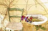 Bouquet in washbasin next to chair