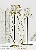 Flowers hanging from table lamps