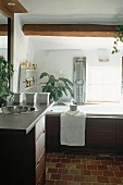 A bathroom with wooden panelling
