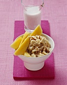 Sweet mie noodles with coconut milk and mango