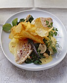 Poached trout on spinach with potato crisps